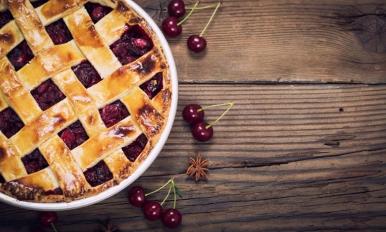 Cherry pie on a wooden table